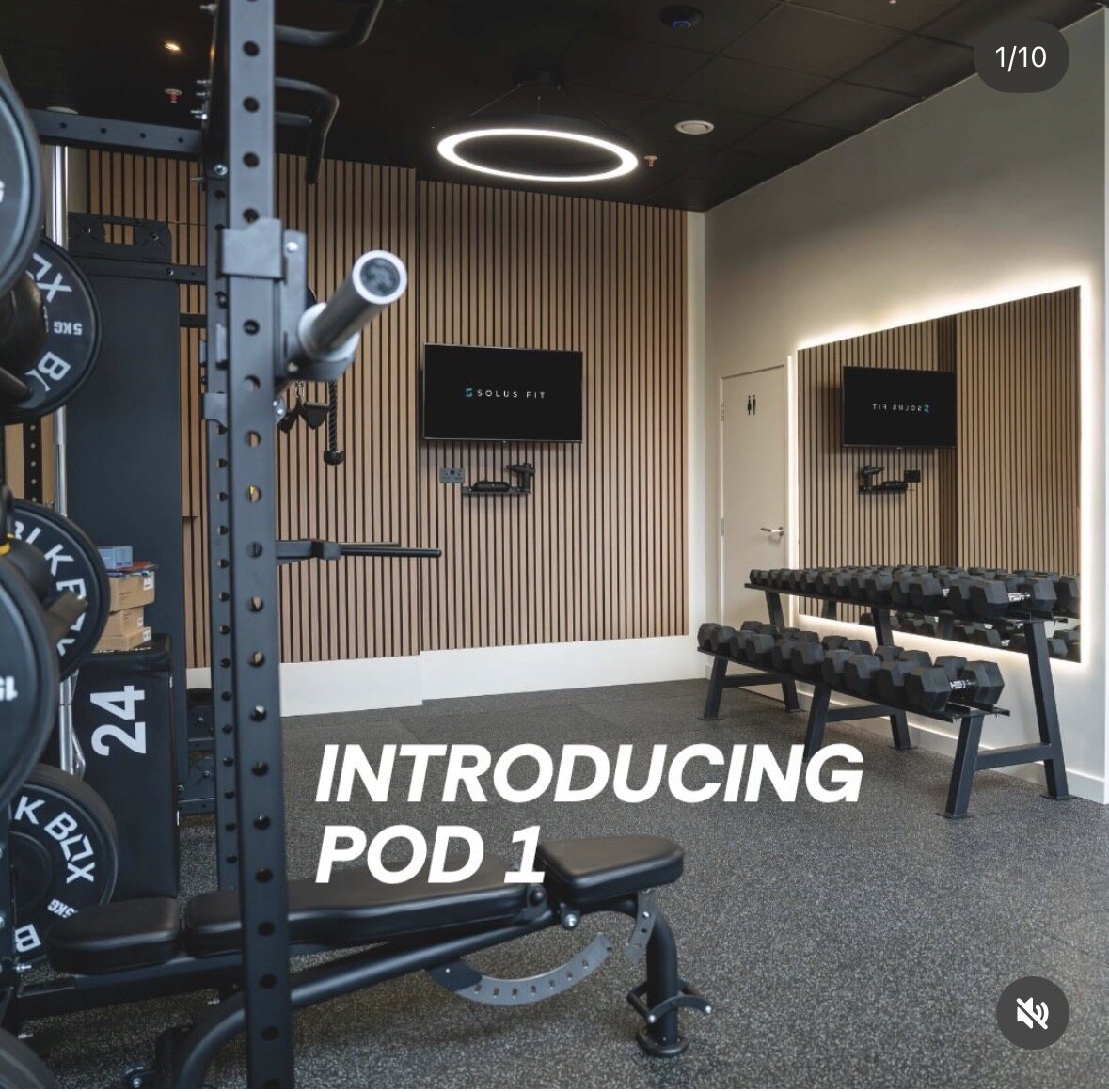 Inside Pod 1 at Solus Fit: a private training pod with a squat rack, dumbbell rack, bench and screen